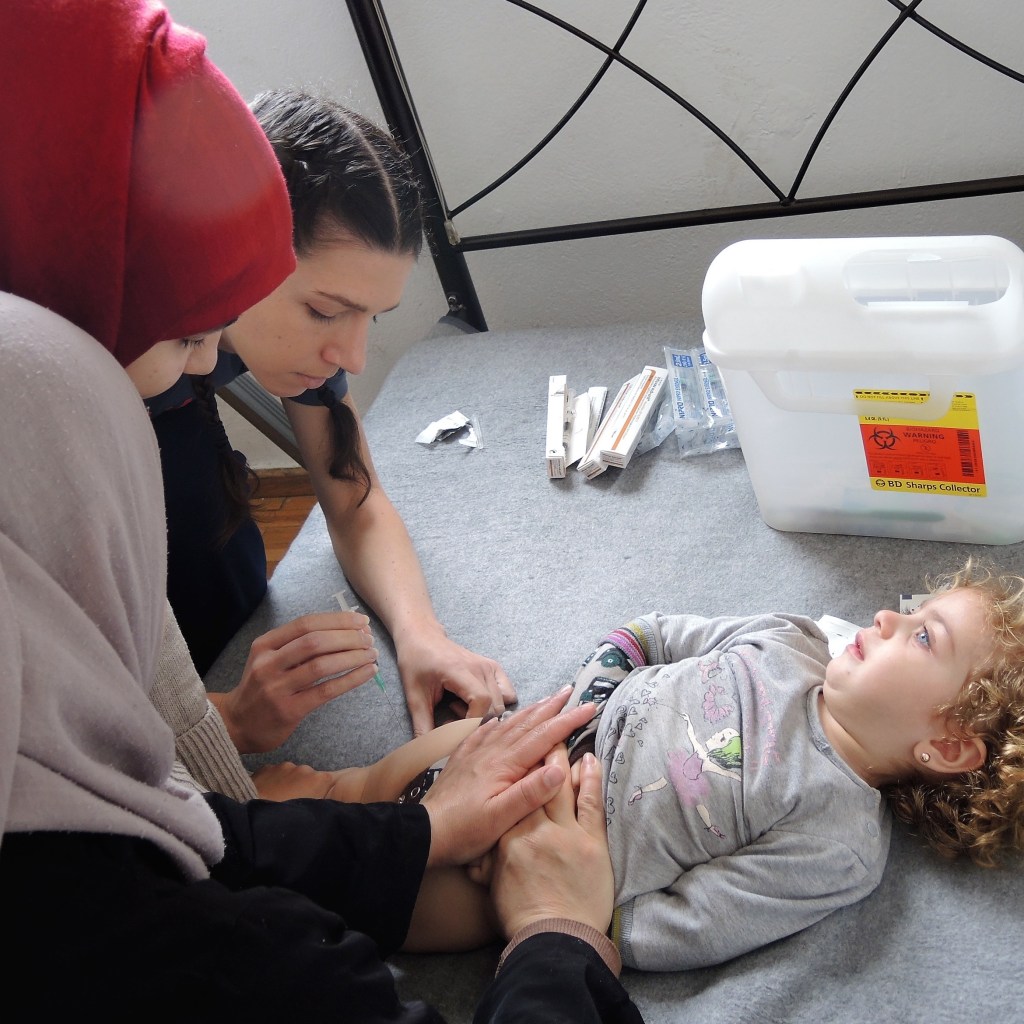 Immunizing a child who was born after the war in Syria began