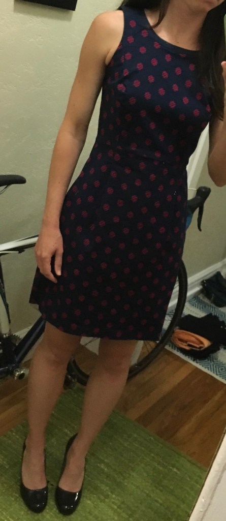 Stolen Calvin Klein sheath dress, navy blue with red polka dot print, size 2 or 4. Black patent leather pumps size 8.5. 